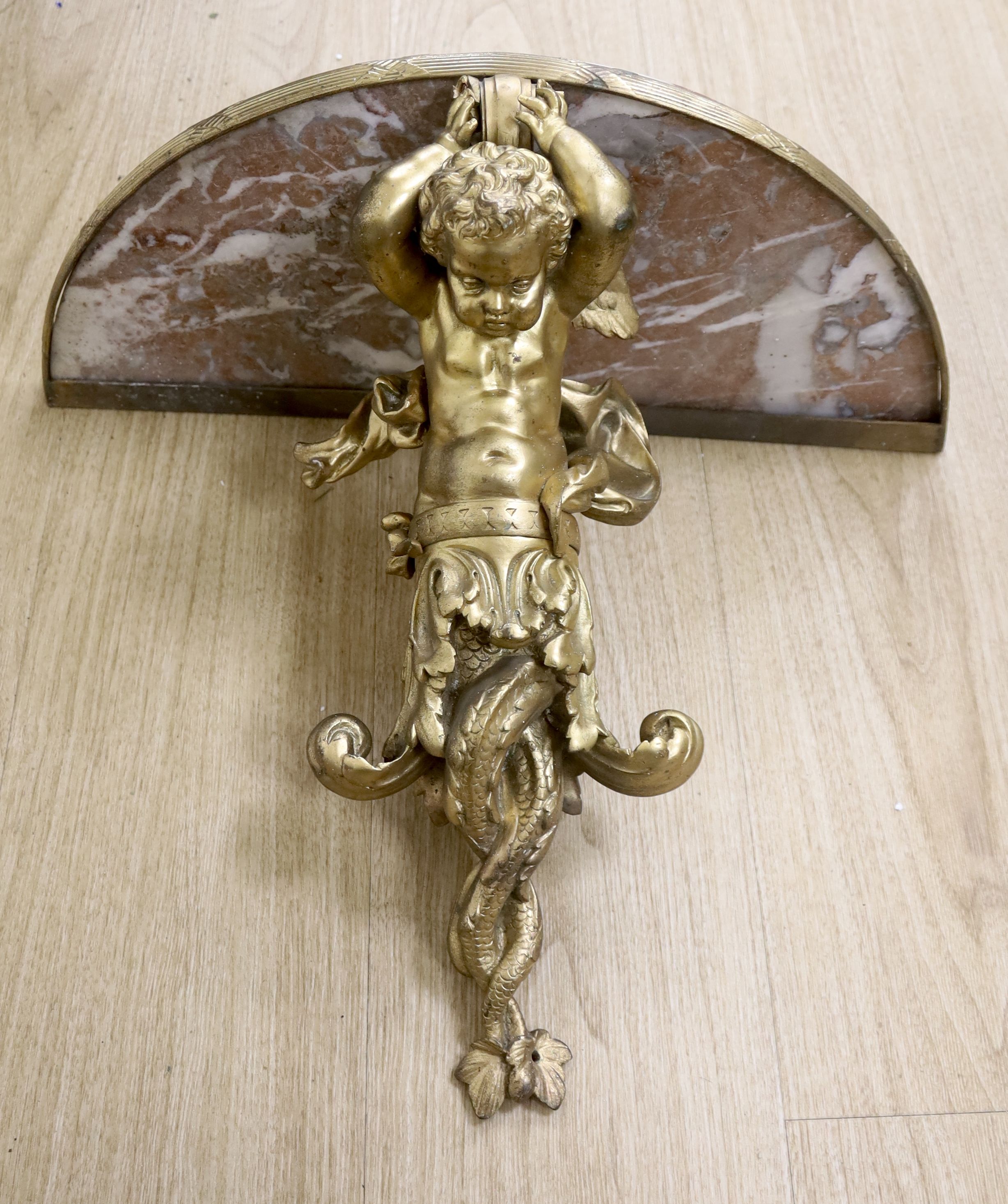 A Louis XV style gilt cast metal marble-topped wall bracket, 52cm wide, 49cm wide